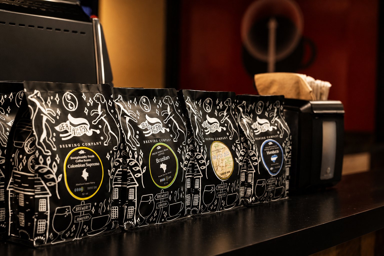 Bags of Death of the Fox whole-bean coffee on retail display